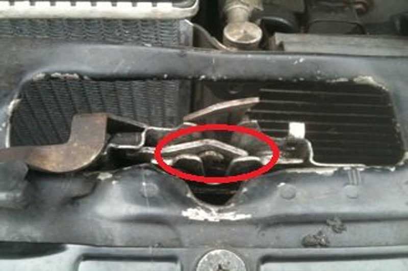 Figure 1. Circled in red is the hood latch, and where you should be 