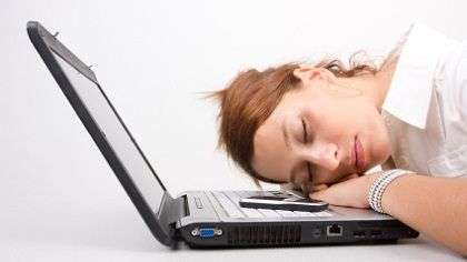 Woman sleeping on her laptop.