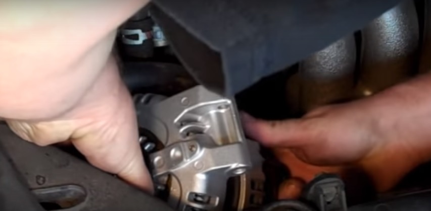 Install the new alternator, bolts, and reconnect the wiring.