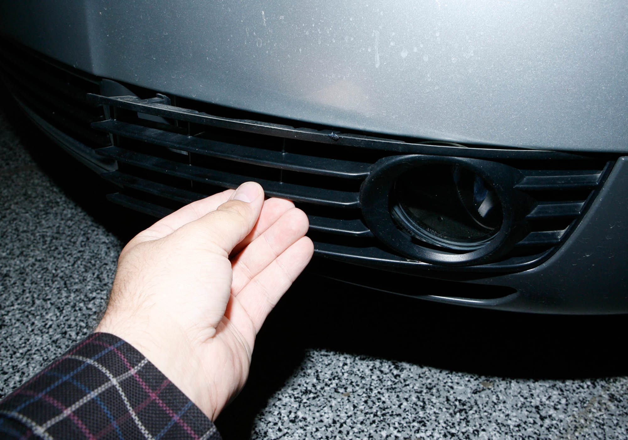 The easiest way to access the front parking light bulbs is through the front fog light grilles.
