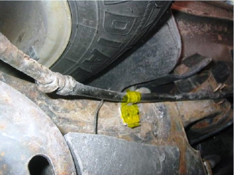 Another view of a cable retaining clip (yellow)