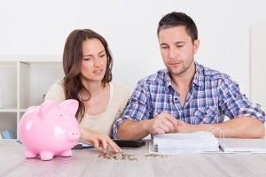 couple looking at their finances, calculate budget