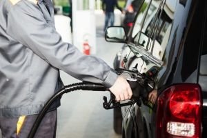 pumping gas into vehicle