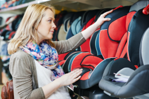 mom choosing children car seat, mom looking at kid car seats