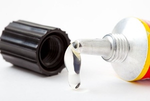 Adhesive dripping from an open tube