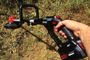 Person using a string trimmer