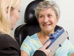 Image of an elderly woman getting a check-up.