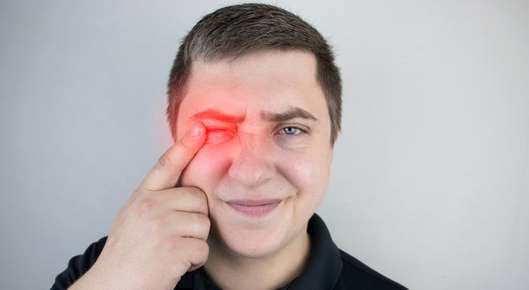 Image of a woman getting an eye exam.