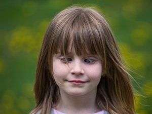 Image of a cross-eyed young girl.