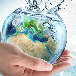 hands holding a water-filled globe