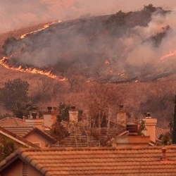 Brush fire threatening homes