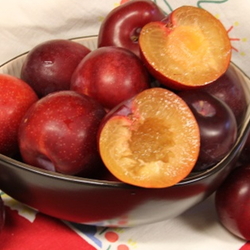 red plums in a bowl