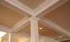A warm, decorative ceiling in a home.
