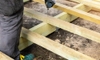 How do I lay floorboards onto joists?