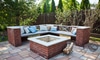 A patio with a brick firepit and bench.