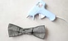 craft glue gun laying next to a bow tie