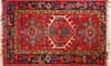 Red oriental rug with fringe