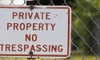 fence with no trespassing sign