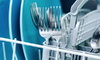 a dishwasher rack with plates and silverware