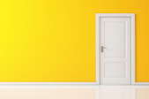 A white, interior door set into a yellow wall.