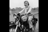 woman on a motorcycle in black and white photo