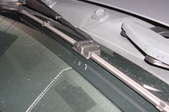 A car with windshield wiper blades.
