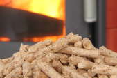 a lit pellet stove with extra pellets