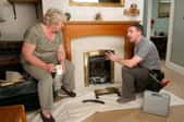 Man talking to a woman about fireplace