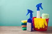 A grouping of cleaning products including a bucket and spray bottle.