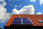 Solar panels on a terracotta roof.