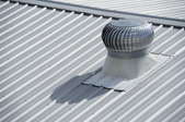 A roof vent on a metal roof.