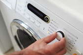 turning dial on washing machine