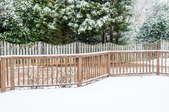 a snow covered fence