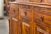 A close-up of a wood cabinet.