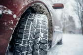 A car tire in snow. 