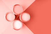 four cans of pink paint with pink background colors