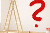 an empty room with a ladder and red paint question mark on wall