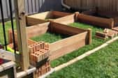 raised garden beds in construction in a backyard