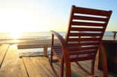 empty rocking chair on beach deck