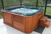 an outdoor hot tub with wooden paneling