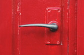 red door with lever handle