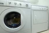 white washing machine and dryer in laundry room