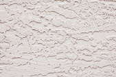 A close up on stucco drywall.