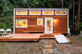 stylish wooden tiny home in a forest setting
