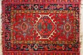 Red oriental rug with fringe