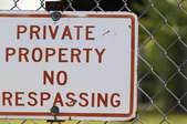 fence with no trespassing sign