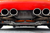 exhaust pipes on the back of a red car