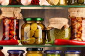 food goods in jars on a glass shelf