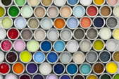A selection of colorful paint cans.