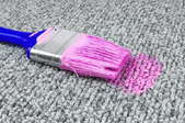 pink paint stain from a paintbrush on carpet